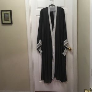 A beautiful wide sleeve silk black and white Abaya